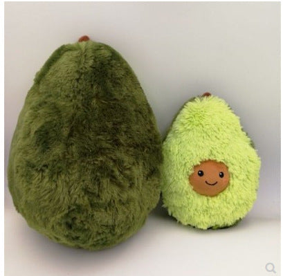 Two plush avocados, one with a face, on a white background