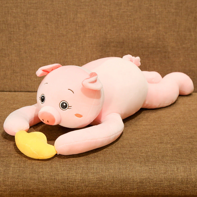 Plush pig toy lying on a brown surface