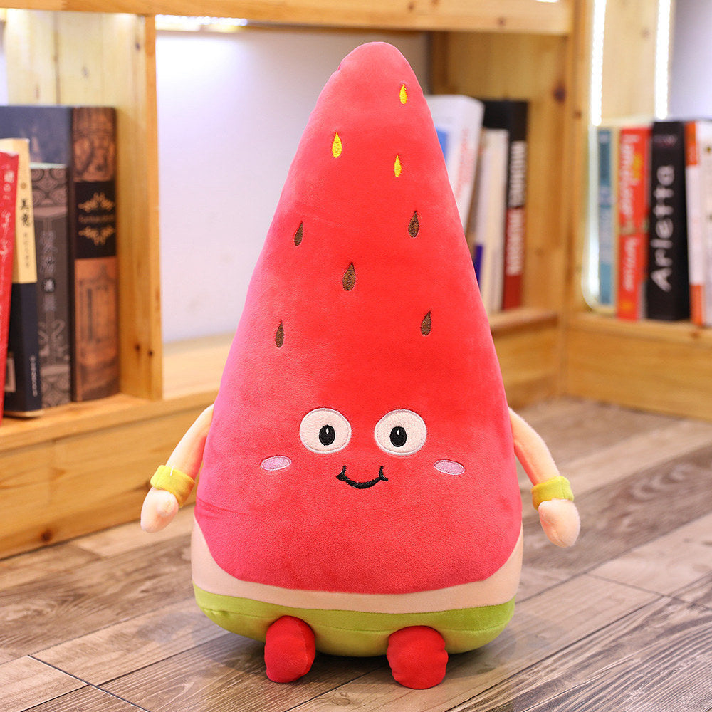 Plush toy shaped like a watermelon with a smiling face on a wooden floor.