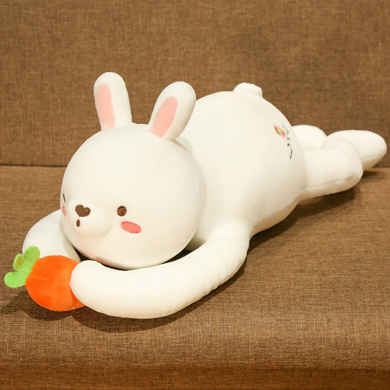 White plush toy resembling a rabbit with a carrot on a brown background