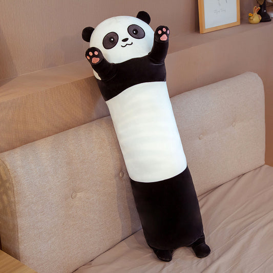 Plush panda toy on a beige couch