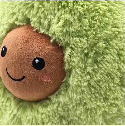 Plush toy with a smiling face peeking out from behind green fabric