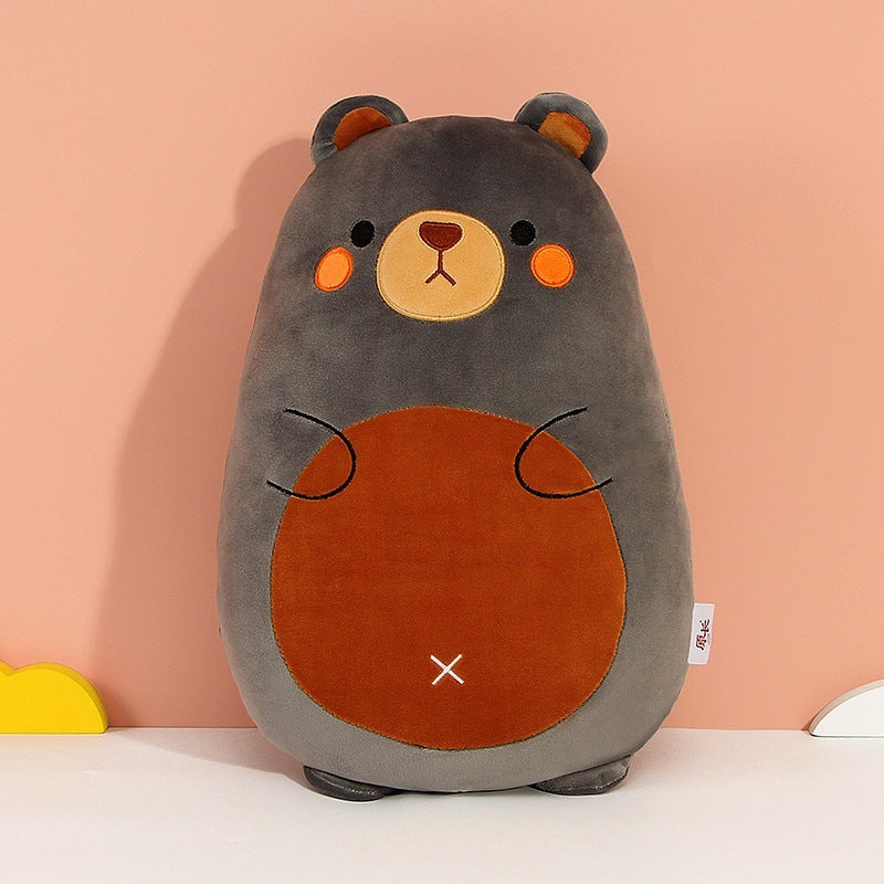 Plush toy bear with a brown belly on a pink background
